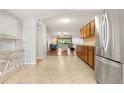 Open kitchen features stainless appliances and access to living room at 1028 Apollo Beach Blvd # 203, Apollo Beach, FL 33572