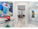 Foyer featuring stylish decor, artwork, and a glimpse into the open-concept living space at 1325 Snell Isle Ne Blvd # 708, St Petersburg, FL 33704