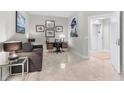 Cozy seating area or office space featuring neutral tones and a view towards the hallway and elevator at 1325 Snell Isle Ne Blvd # 708, St Petersburg, FL 33704