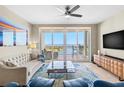Bright living room boasts expansive waterfront views, modern furnishings, and a neutral color palette at 1325 Snell Isle Ne Blvd # 708, St Petersburg, FL 33704