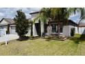 Beautiful home showcasing elegant landscaping and a well-kept lawn at 14015 Arbor Pines Dr, Riverview, FL 33579