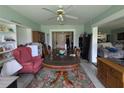 Cozy dining room featuring a large wooden table and a floral rug at 18804 Tournament Trl, Tampa, FL 33647