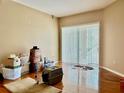 Bright living room with sliding glass doors leading to the backyard, good for natural light at 23112 Emerson Way, Land O Lakes, FL 34639