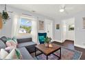 Cozy living room with large window, ceiling fan, and stylish decor at 3230 4Th S Ave, St Petersburg, FL 33712