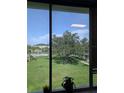 Enjoy the verdant lawn and a community pool view from the comfort of your home at 4705 Ne 1St Ne St # 327, St Petersburg, FL 33703