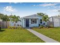 Charming single-story home with a well-manicured lawn and inviting walkway at 4755 21St N Ave, St Petersburg, FL 33713