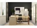 Modern home office featuring a wooden desk, stylish decor, and plenty of natural light at 7542 E 117Th Ln, Palmetto, FL 34221
