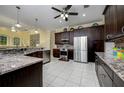 Spacious kitchen with stainless appliances, granite countertops and custom cabinetry at 8444 Shenandoah Run, Wesley Chapel, FL 33544