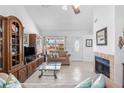 Bright living area featuring tile floors, vaulted ceilings, and a cozy fireplace at 10213 Westport Ct, Tampa, FL 33615