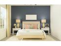Cozy bedroom featuring soft lighting, neutral decor, and stylish bedside tables at 11836 Blue Diamond Trl, Parrish, FL 34219