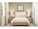 Cozy bedroom with neutral decor, soft lighting, stylish lamps and a patterned rug at 12313 Precious Ruby Way, Parrish, FL 34219