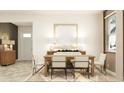 Bright dining area with a modern table set, stylish decor, and ample natural light at 12313 Precious Ruby Way, Parrish, FL 34219