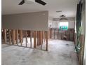 Renovated kitchen showing a work in progress with exposed framing and updated cabinetry at 1726 Massachusetts Ne Ave, St Petersburg, FL 33703