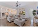 Inviting living room with a comfortable sectional sofa, natural light, and an open-concept design at 1936 Floresta View Dr, Tampa, FL 33618