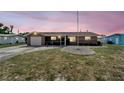 Charming single-story home with a well-maintained lawn, cozy front porch, and attached garage, radiating curb appeal at 260 Venice East Blvd, Venice, FL 34293