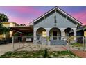 Charming bungalow-style home with a covered carport and front porch arches at 2825 N Taliaferro N Ave, Tampa, FL 33602