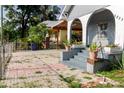 Paver driveway and steps with planters near front porch arches at 2825 N Taliaferro N Ave, Tampa, FL 33602