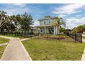 Charming two-story home with a cozy front porch and well-maintained landscaping at 4301 5Th N Ave, St Petersburg, FL 33713