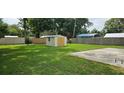 Expansive backyard featuring a storage shed and plenty of green space at 4754 17Th St, Zephyrhills, FL 33542