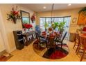 Kitchen dining area with a dining table and bay window that fills the space with natural light at 502 Dewolf Rd, Brandon, FL 33511