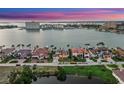Sunset aerial view showcasing a beautiful waterfront community with stunning water views at 5287 61St S Ave, St Petersburg, FL 33715