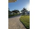 A beautiful brick driveway adds curb appeal to this home at 6034 Bayou Grande Ne Blvd, St Petersburg, FL 33703