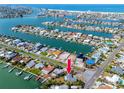 Aerial view of waterfront property with canal access and proximity to the Gulf, showcasing the home's location at 11465 7Th E St, Treasure Island, FL 33706