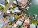 Aerial view highlighting property with waterfront access, dock, and nearby boating opportunities at 11465 7Th E St, Treasure Island, FL 33706