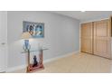 Elegant hallway with tile flooring, artwork, and a stylish glass-topped table at 1200 Gulf Blvd # 1704, Clearwater Beach, FL 33767