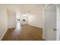 Open living room with new laminate floors and a ceiling fan at 12437 Foxmoor Peak Dr, Riverview, FL 33579