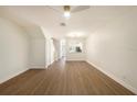 Spacious living area featuring wood-look flooring and neutral wall color at 12437 Foxmoor Peak Dr, Riverview, FL 33579