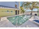 Relaxing community pool with sundeck and chairs offers a refreshing escape for residents at 1501 Doyle Carlton Dr # 303, Tampa, FL 33602