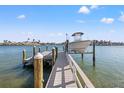 A private boat dock with a boat lift provides access to the open water at 17077 Dolphin Dr, North Redington Beach, FL 33708