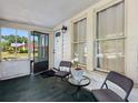 Cozy porch with seating, a table, and view of the neighborhood at 302 W Curtis St, Tampa, FL 33603
