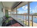 Relaxing screened porch overlooking the water, perfect for enjoying waterfront views at 4137 Des Prez Ct, Hernando Beach, FL 34607