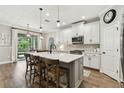 Modern eat-in kitchen featuring a center island with bar stool seating, and stainless steel appliances at 6214 Windship Ct, Tampa, FL 33647
