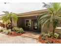 Inviting front entrance featuring palm trees and a cozy front porch, enhancing curb appeal at 6635 9Th N Ave, St Petersburg, FL 33710
