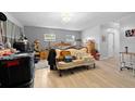Spacious bedroom featuring wood-look floors, neutral walls, and lots of natural light at 6807 N Himes Ave, Tampa, FL 33614