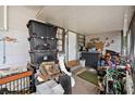 Screened porch with storage containers and other items, offering practical outdoor space at 6807 N Himes Ave, Tampa, FL 33614
