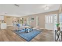 Inviting living room with new floors, large windows, and ample natural light at 704 Childers Loop, Brandon, FL 33511