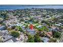 A home from an aerial view showcases its location in a peaceful neighborhood by a body of water at 7815 16Th Nw Ave, Bradenton, FL 34209