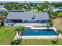 Aerial view showing a pool, patio, and landscaped backyard with a well-maintained lawn at 7815 16Th Nw Ave, Bradenton, FL 34209