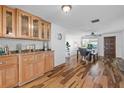 Elegant dining area featuring hardwood floors, stylish cabinetry, and ample natural light at 12359 82Nd N Ave, Seminole, FL 33772