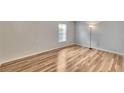 Bedroom featuring light wood floors, a large window, and ample natural light at 125 Picardy Villa Cir # 100, Brandon, FL 33510