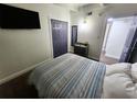 Cozy bedroom features a comfortable bed, closet, and neutral decor at 1335 Waikiki Way, Tampa, FL 33619
