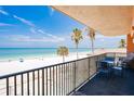 Balcony with a view of the beach and ocean, seating for relaxing and enjoying the scenery at 17334 Gulf Blvd # 203, North Redington Beach, FL 33708