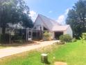 Charming two-story home with a screened porch and well-maintained landscaping at 20989 Negril, Lutz, FL 33558