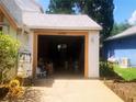Open garage providing ample parking and storage at 20989 Negril, Lutz, FL 33558