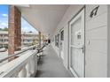 Exterior view of the unit entrance and covered balcony, providing a private outdoor space at 2461 Rhodesian Dr # 47, Clearwater, FL 33763