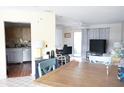 Open-concept living area featuring a dining area, modern furnishings, and bright natural light at 413 Lake Point Ct # 4B, Sun City Center, FL 33573